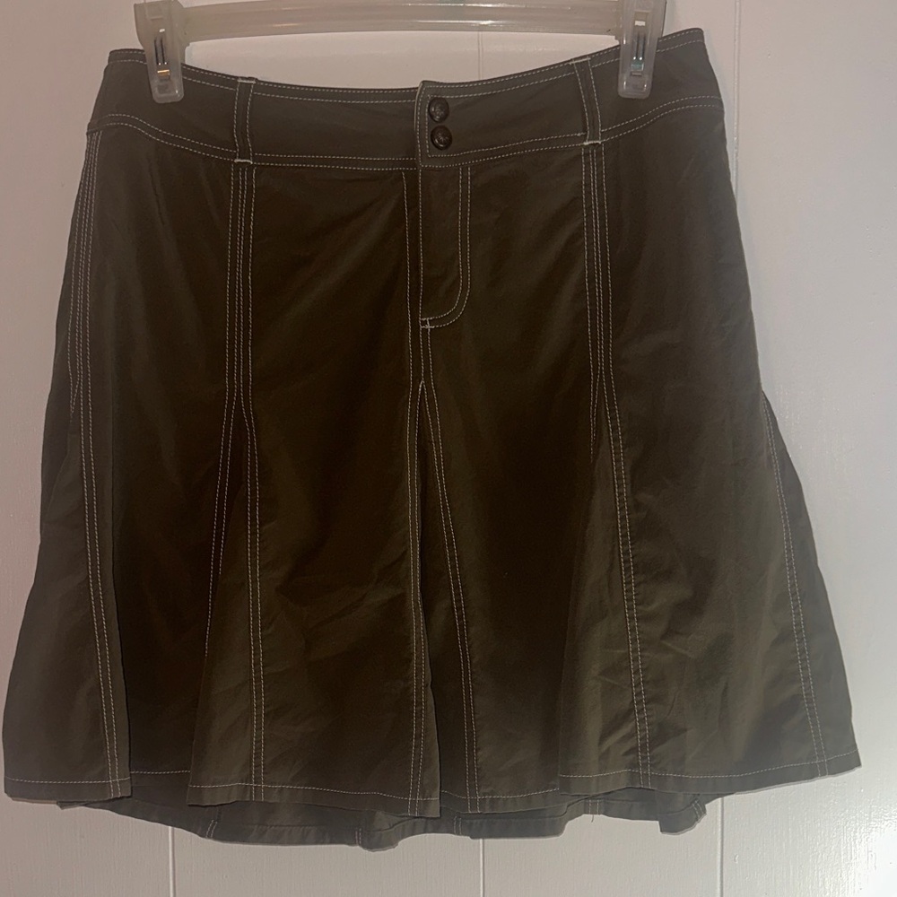 Athleta Olive Whatever Skort in olive green/brown, white contrast stitching.